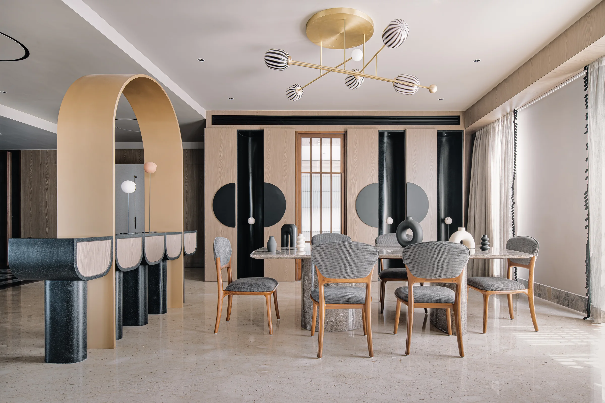 Arjun Rathi chandelier in an arched dining room at Elementi Bengaluru